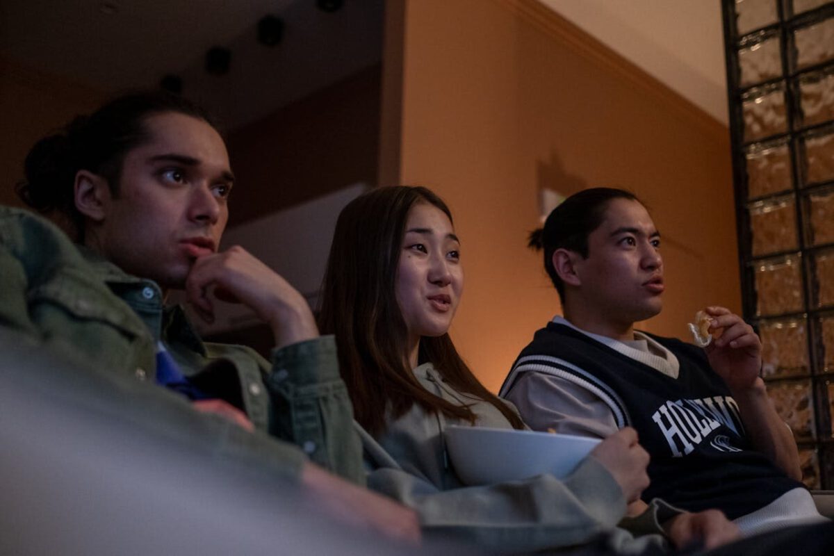 Three people on a sofa watching tv, a form of counselling