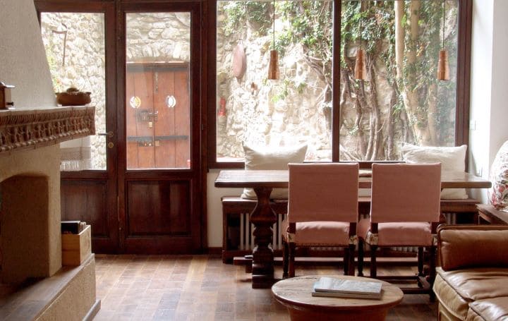 Waiting room of a hotel with big French windows